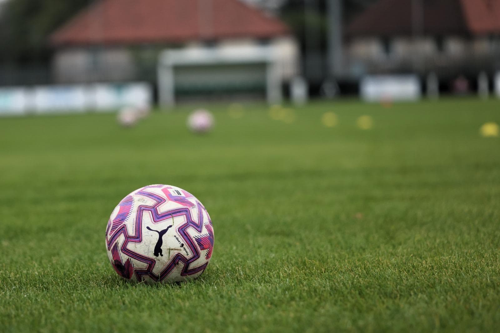 A match ball on the pitch at Olympic Park